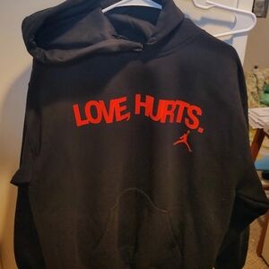 Black Hoodie with Red 'Love, Hurts' Print